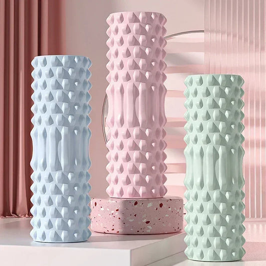 BackBalance spike massage roller for back pain in pastel blue pink and green colors with textured surface
